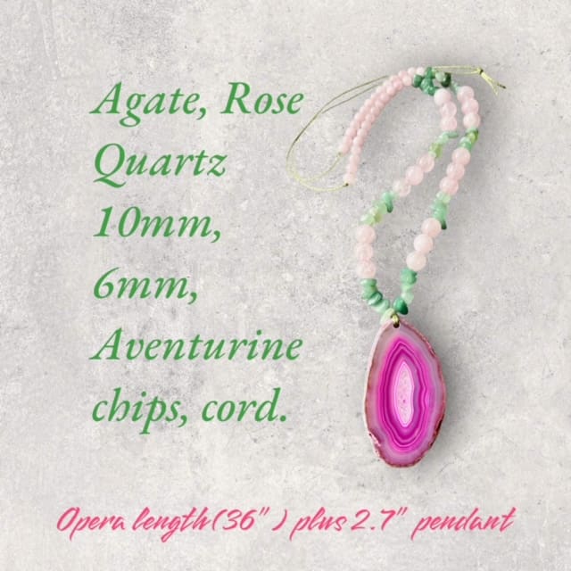 A pink agate necklace with an oval shaped stone.