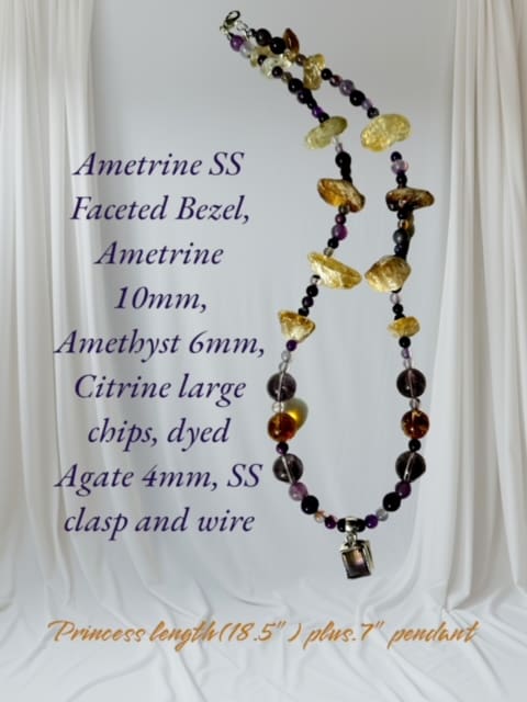 A necklace with different colored beads and a purple cord.