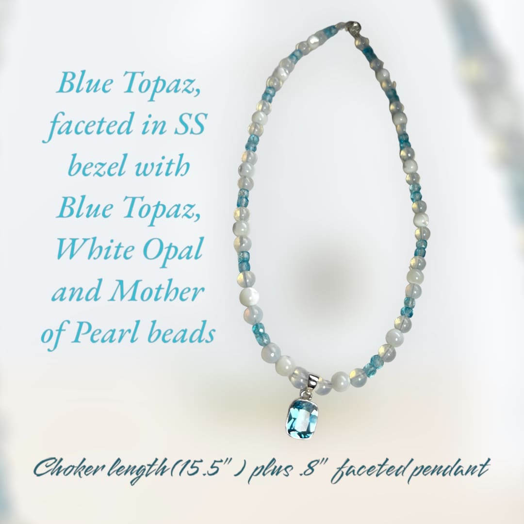 A blue topaz necklace with a mother of pearl bead.