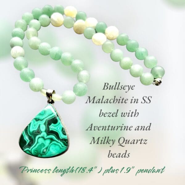 A necklace with green beads and a malachite pendant.