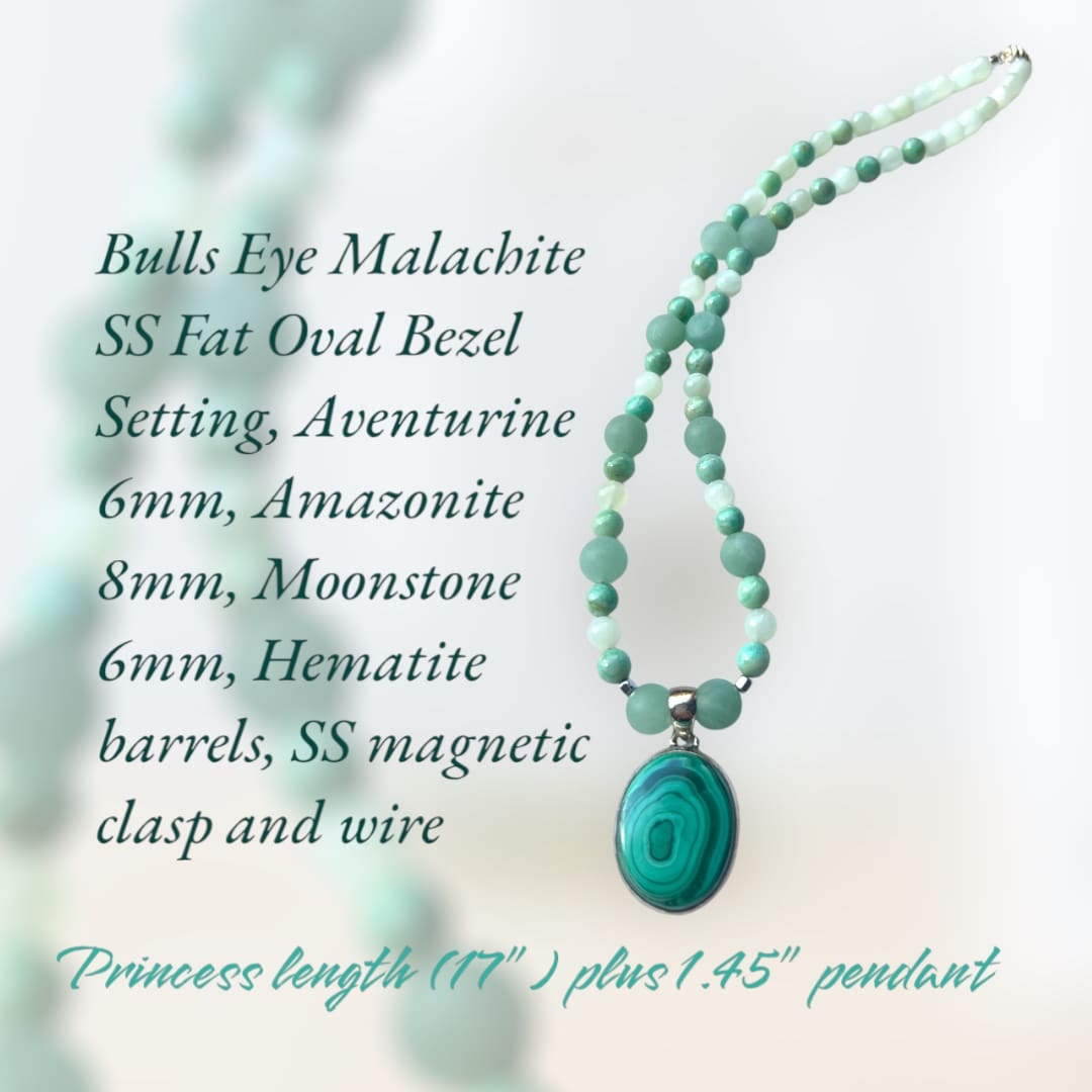 A necklace with an oval shaped bead and a turquoise colored stone.