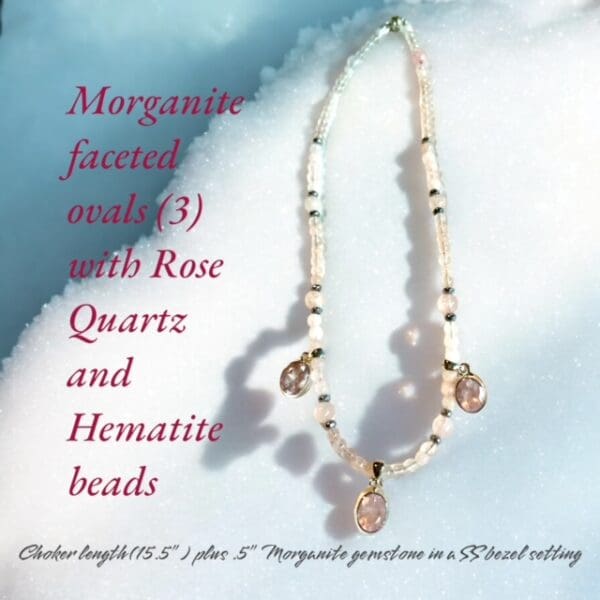 A necklace with a rose quartz bead and hematite beads.