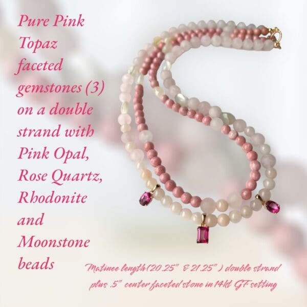 A pink and white necklace with a pink stone.