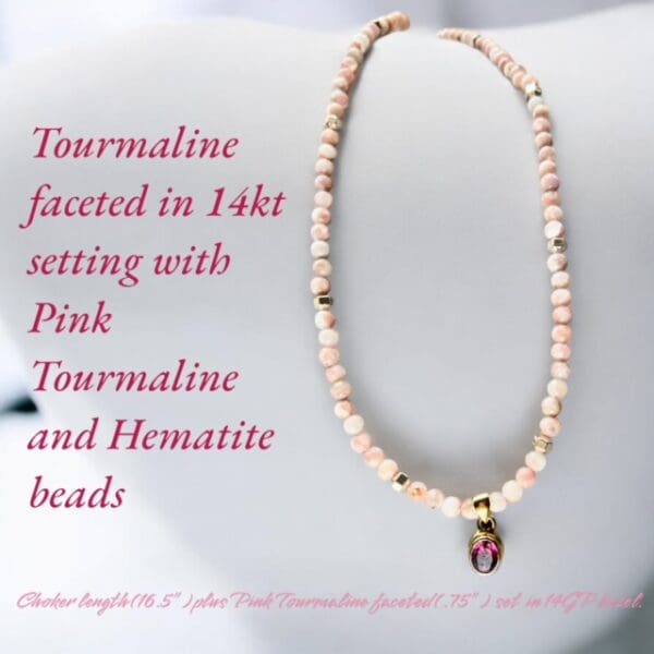 A necklace with pink tourmaline and hematite beads.