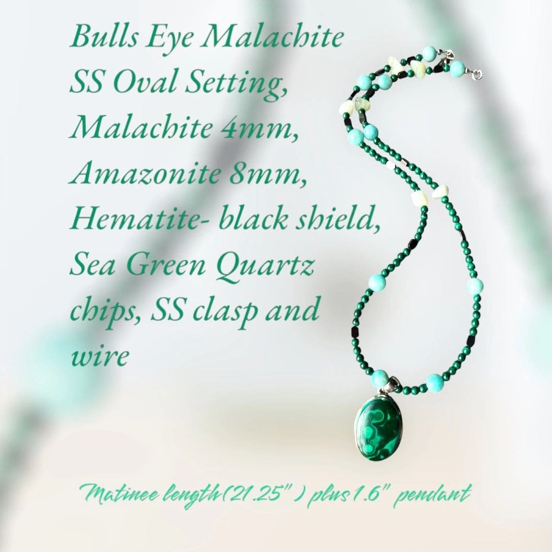 A necklace with an oval shaped green bead.