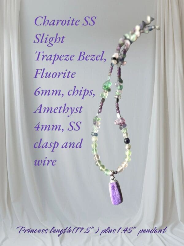 A necklace with a purple bead and a green stone.