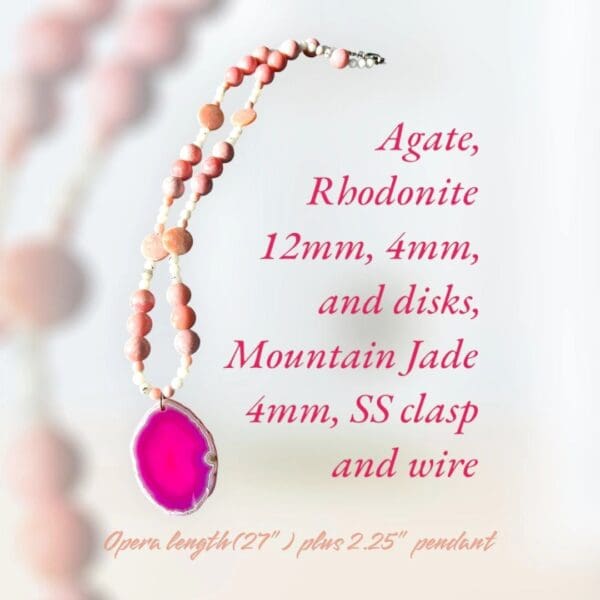 A pink necklace with an oval shaped stone.