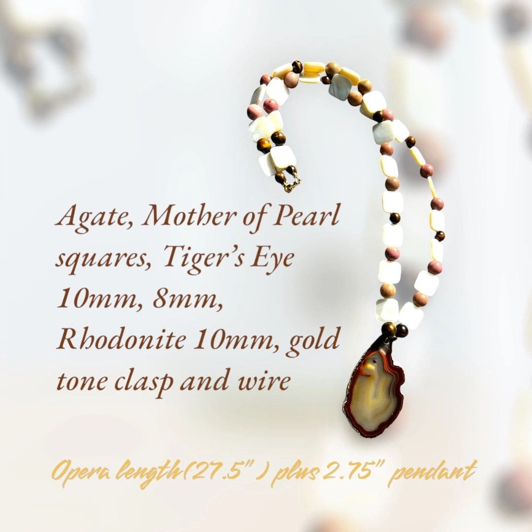 A necklace with an agate, mother of pearl and gold bead.