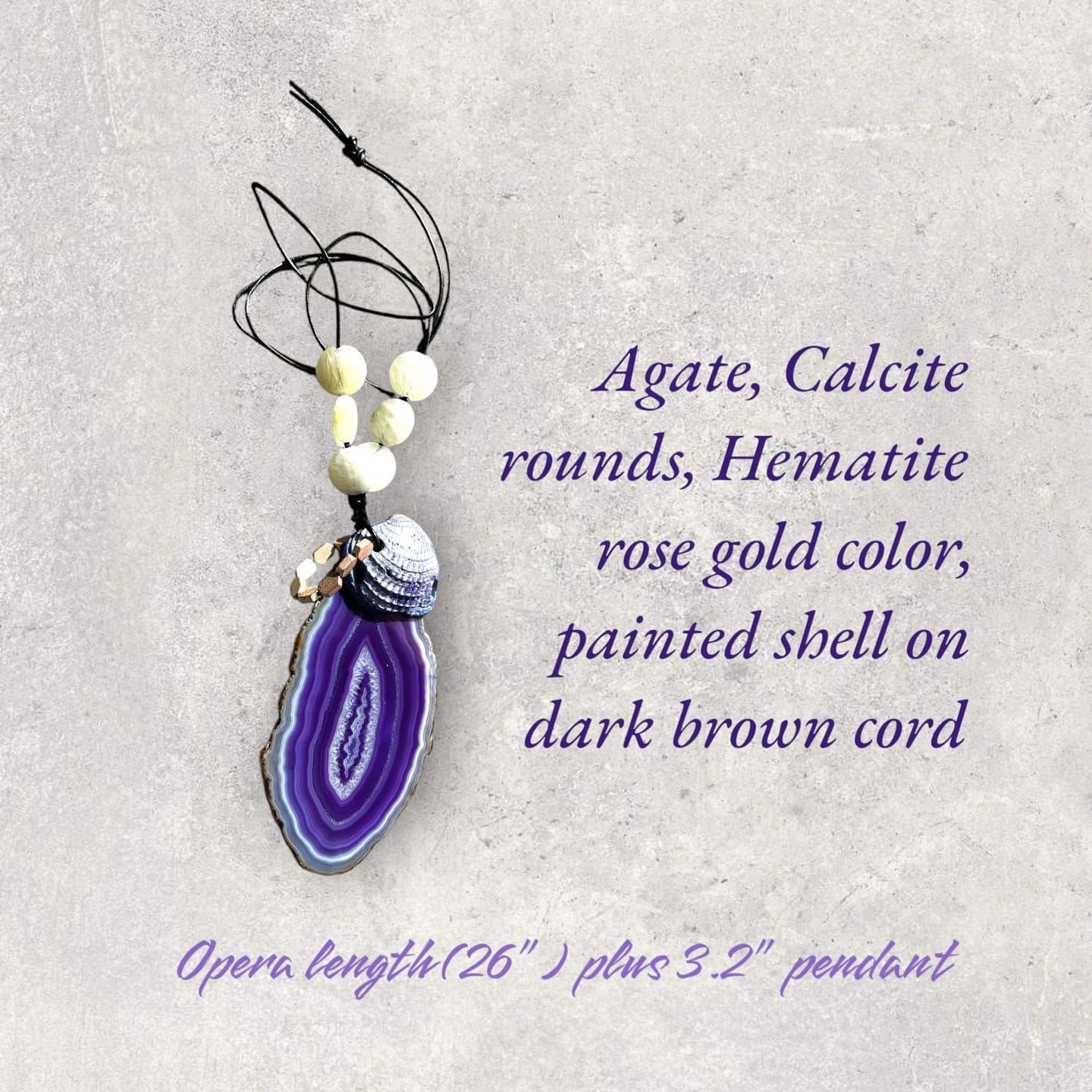 A necklace with an agate and a purple stone.