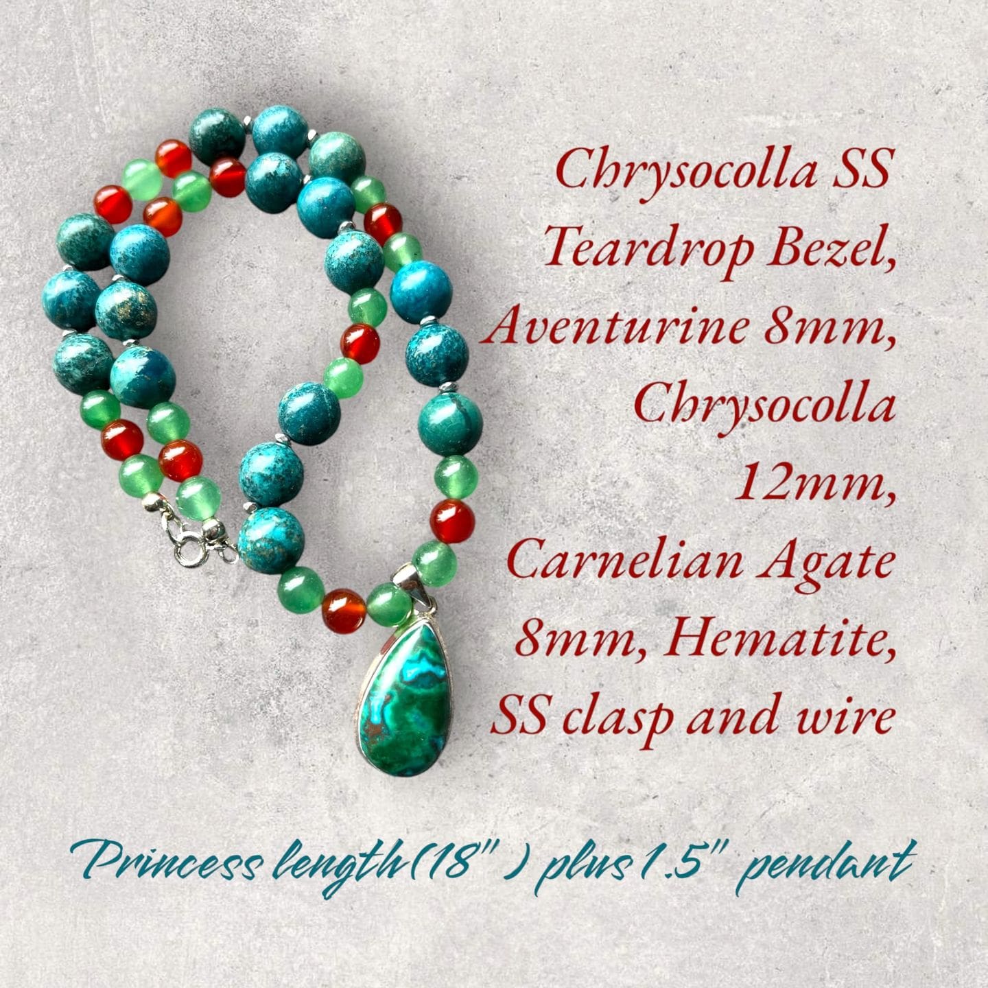 A necklace with a green bead and turquoise stone.