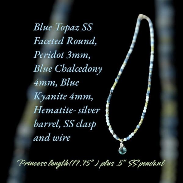 A necklace with a blue topaz and silver chain.