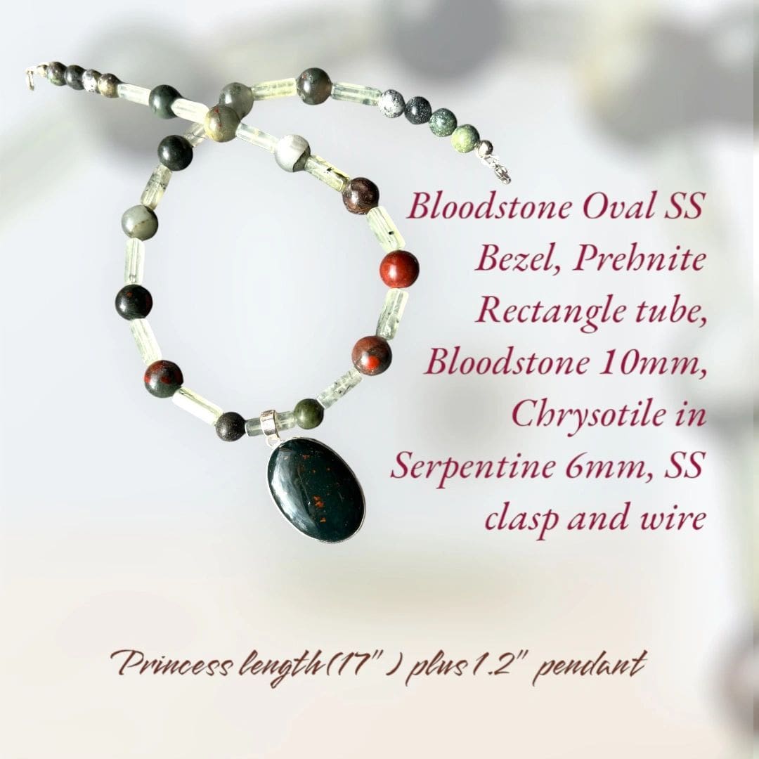 A necklace with a rosary beads and a black stone.