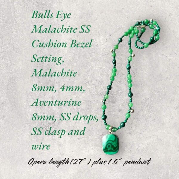 A green necklace with an emerald stone on it.